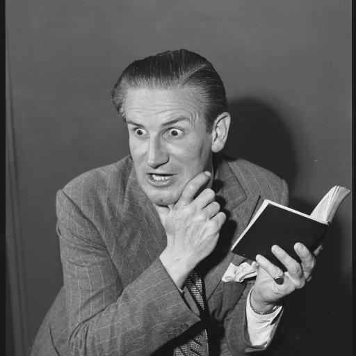 A man holding an open book